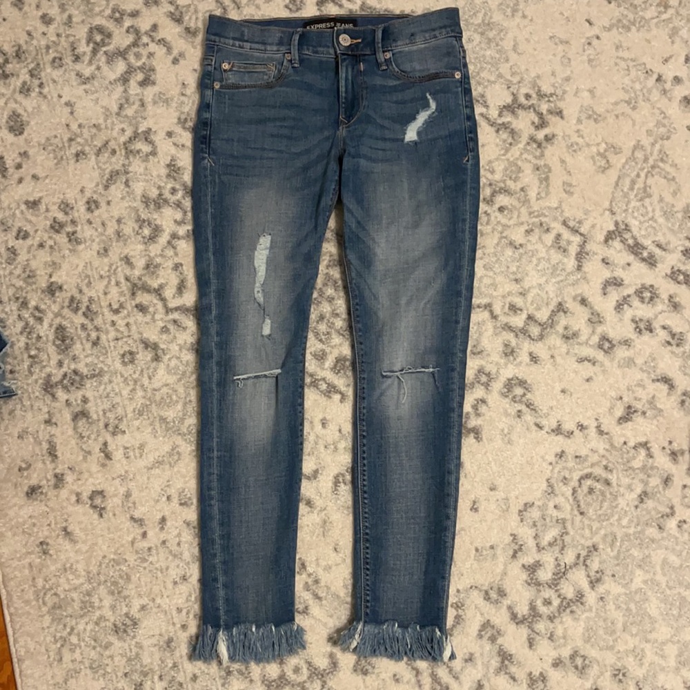 Express jeans with fringe bottom